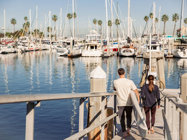 Dockside Adventure Center at Portofino Marina with kayaks and paddleboards